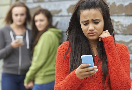 Teenage Girl Being Bullied By Text Message